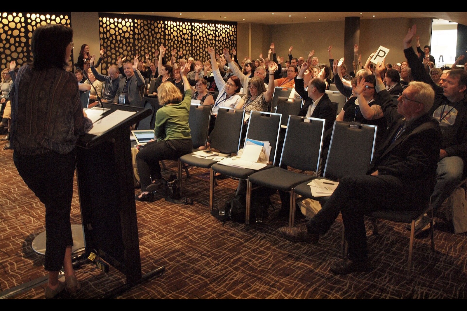 Members of the Australian Society of Archivists taking a vote at their annual general meeting